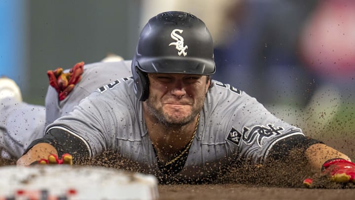 Chicago White Sox left fielder Andrew Benintendi (23) slides into third base against the Minnesota Twin at Target Field. Chicago White Sox left fielder Andrew Benintendi (23) slides into third base against the Minnesota Twin at Target Field.