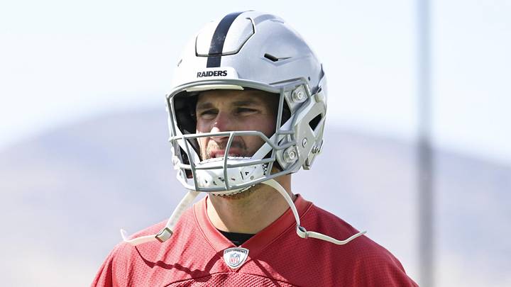 Las Vegas Raiders quarterback Kirk Cousins warms up during organized team activities.