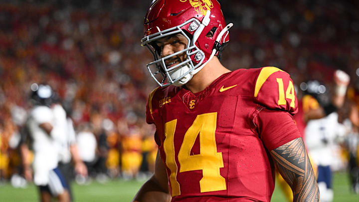 Sep 7, 2024; Los Angeles, California, USA; USC Trojans quarterback Jayden Maiava scores a touchdown against the Utah State Aggies during the fourth quarter at United Airlines Field at Los Angeles Memorial Coliseum.
