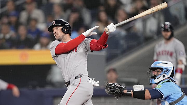 Apr 30, 2025; Toronto, Ontario, CAN; Boston Red Sox third baseman Alex Bregman (2) hits a solo home run against the Toronto Blue Jays during the first inning at Rogers Centre. Apr 30, 2025; Toronto, Ontario, CAN; Boston Red Sox third baseman Alex Bregman (2) hits a solo home run against the Toronto Blue Jays during the first inning at Rogers Centre.