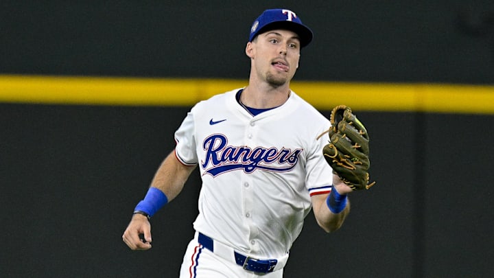 May 2, 2024; Arlington, Texas, USA; Texas Rangers center fielder Evan Carter (32) catches a fly ball against the Washington Nationals during the seventh inning at Globe Life Field