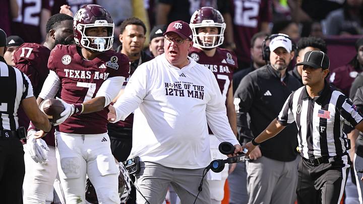 Texas A&M Aggies head coach Mike Elko reacts to a call during the game between the Aggies and the Hurricanes at Kyle Field. Texas A&M Aggies head coach Mike Elko reacts to a call during the game between the Aggies and the Hurricanes at Kyle Field.