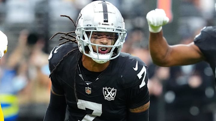 Oct 13, 2024; Paradise, Nevada, USA; Las Vegas Raiders safety Tre'von Moehrig (7) celebrates between Pittsburgh Steelers quarterback Justin Fields (2) and Las Vegas Raiders defensive end Charles Snowden (49) after making a defensive play against the Pittsburgh Steelers during the first quarter at Allegiant Stadium. Mandatory Credit: Stephen R. Sylvanie-Imagn Images