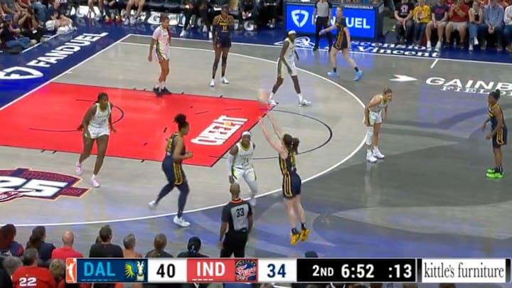 Caitlin Clark lets one fly from deep.