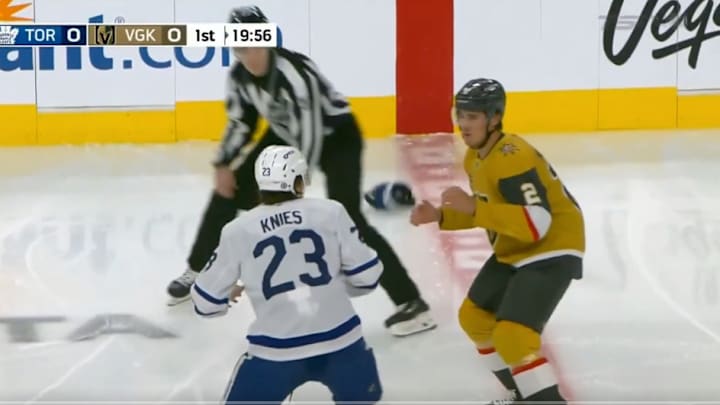 Toronto Maple Leafs F Matthew Knies and Vegas Golden Knights D Zach Whitecloud fight in the first period. 