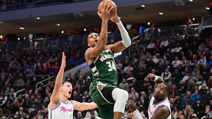 Jan 23, 2025; Milwaukee, Wisconsin, USA; Milwaukee Bucks forward Giannis Antetokounmpo (34) takes a shot between Miami Heat forward Nikola Jovic (5) and guard Terry Rozier (2) in the second quarter at Fiserv Forum. Mandatory Credit: Benny Sieu-Imagn Images Jan 23, 2025; Milwaukee, Wisconsin, USA; Milwaukee Bucks forward Giannis Antetokounmpo (34) takes a shot between Miami Heat forward Nikola Jovic (5) and guard Terry Rozier (2) in the second quarter at Fiserv Forum. Mandatory Credit: Benny Sieu-Imagn Images