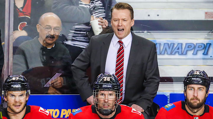 Mar 31, 2018; Calgary, Alberta, CAN; Calgary Flames head coach Glen Gulutzan on his bench against the Edmonton Oilers during the third period at Scotiabank Saddledome. Calgary Flames won 3-2. Mandatory Credit: Sergei Belski-Imagn Images