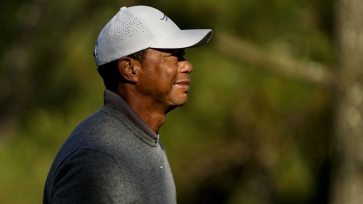 Apr 12, 2024; Augusta, Georgia, USA; Tiger Woods reacts to his fairway shot on no. 18 during the