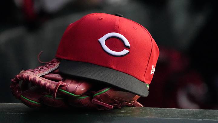 May 5, 2026; Chicago, Illinois, USA; A detail shot of Cincinnati Reds hat and glove in the dugout during the fourth inning against the Chicago Cubs at Wrigley Field. Mandatory Credit: David Banks-Imagn Images May 5, 2026; Chicago, Illinois, USA; A detail shot of Cincinnati Reds hat and glove in the dugout during the fourth inning against the Chicago Cubs at Wrigley Field. Mandatory Credit: David Banks-Imagn Images