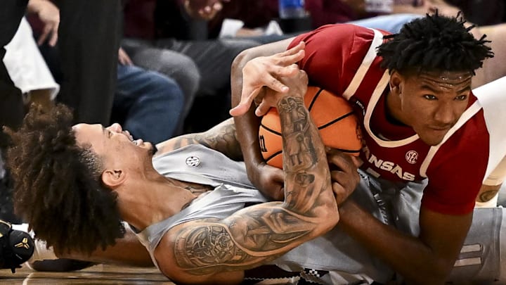 Andersson Garcia (11) and Arkansas Razorbacks forward Karter Knox (11) battle for a loose ball during the second half at Reed Arena. 