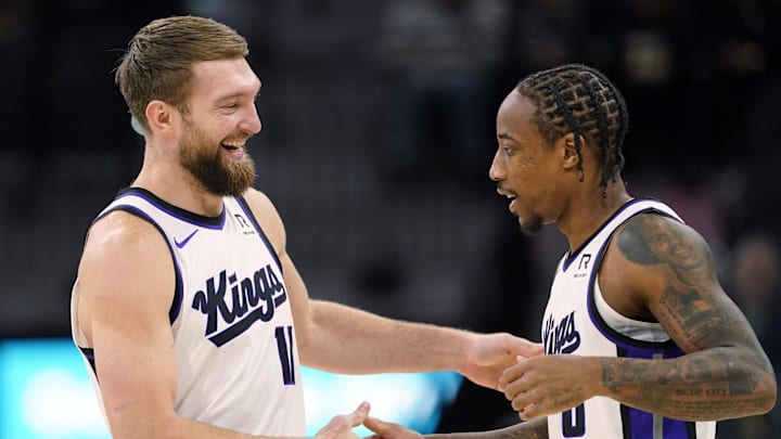 Dec 6, 2024; San Antonio, Texas, USA; Sacramento Kings center Domantas Sabonis (11) and forward DeMar DeRozan (10) embrace before a game the San Antonio Spurs at Frost Bank Center. Mandatory Credit: Scott Wachter-Imagn Images