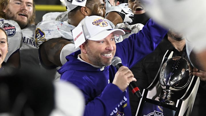 Dec 28, 2024; Annapolis, MD, USA; East Carolina Pirates head coach Blake Harrell celebrates with players after defeating North Carolina State Wolfpack to win the Go Bowling Military Bowl at Navy-Marine Corps Memorial Stadium. Mandatory Credit: Tommy Gilligan-Imagn Images Dec 28, 2024; Annapolis, MD, USA; East Carolina Pirates head coach Blake Harrell celebrates with players after defeating North Carolina State Wolfpack to win the Go Bowling Military Bowl at Navy-Marine Corps Memorial Stadium. Mandatory Credit: Tommy Gilligan-Imagn Images