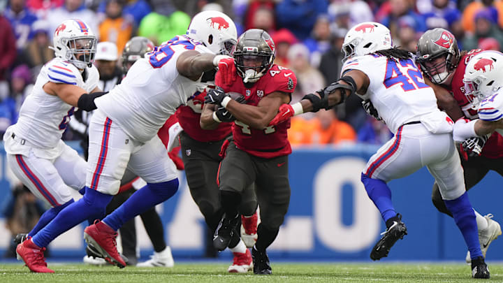 Tampa Bay Buccaneers running back Sean Tucker runs the ball against Buffalo Bills linebacker Dorian Williams.