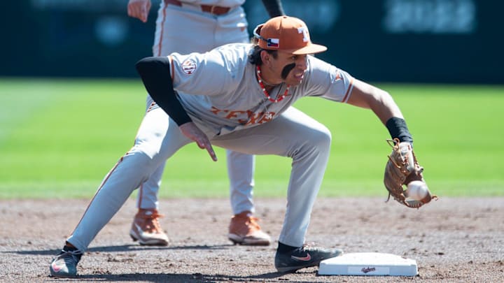 Texas Longhorns' Adrian Rodriguez fields a ground ball.