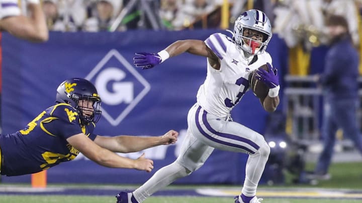 Oct 19, 2024; Morgantown, West Virginia, USA; Kansas State Wildcats running back Dylan Edwards (3) returns a punt during the third quarter against the West Virginia Mountaineers at Mountaineer Field at Milan Puskar Stadium. Mandatory Credit: Ben Queen-Imagn Images