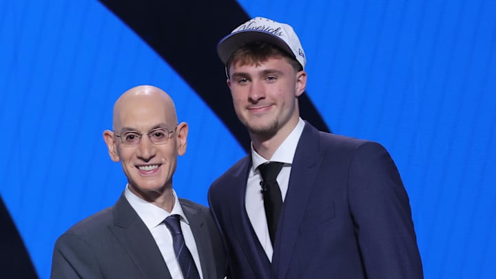 Jun 25, 2025; Brooklyn, NY, USA;  Cooper Flagg poses with NBA commissioner Adam Silver after being selected as first overall by the Dallas Mavericks in the first round of the 2025 NBA Draft at Barclays Center. Mandatory Credit: Brad Penner-Imagn Images