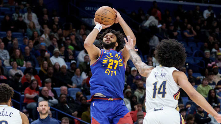 Jan 13, 2026; New Orleans, Louisiana, USA; Denver Nuggets guard Jamal Murray (27) shoots against New Orleans Pelicans guard Micah Peavy (14) during the first half at Smoothie King Center. Jan 13, 2026; New Orleans, Louisiana, USA; Denver Nuggets guard Jamal Murray (27) shoots against New Orleans Pelicans guard Micah Peavy (14) during the first half at Smoothie King Center.
