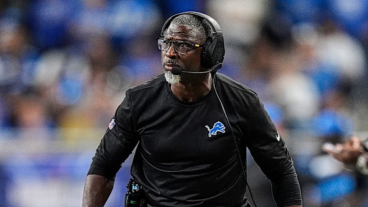 Detroit Lions defensive coordinator Aaron Glenn reacts to a play during a game.