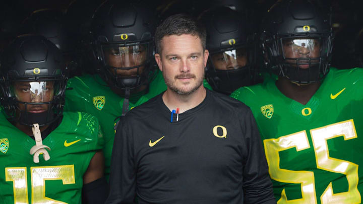 Oregon coach Dan Lanning leads his team onto the field before the game against Colorado in Eugene Saturday, Sept. 23, 2023.