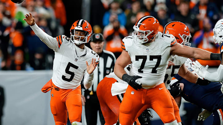 Cleveland Browns quarterback Jameis Winston (5) attempts a pass as guard Wyatt Teller (77) defends Cleveland Browns quarterback Jameis Winston (5) attempts a pass as guard Wyatt Teller (77) defends