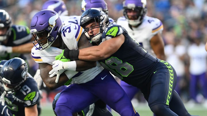 Aug 10, 2023; Seattle, Washington, USA; Seattle Seahawks linebacker Levi Bell (98) tackles Minnesota Aug 10, 2023; Seattle, Washington, USA; Seattle Seahawks linebacker Levi Bell (98) tackles Minnesota