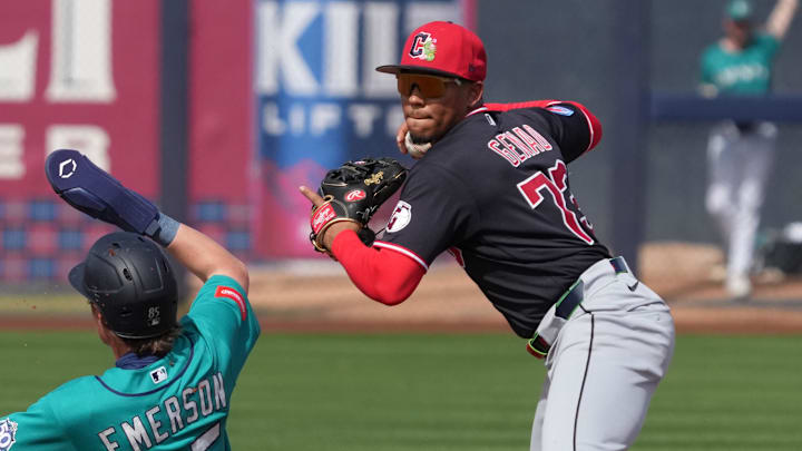 Feb 26, 2026; Peoria, Arizona, USA; Cleveland Guardians third baseman Angel Genao (73) gets the force out against Seattle Mariners shortstop Colt Emerson (85) in the second inning at Peoria Sports Complex. Mandatory Credit: Rick Scuteri-Imagn Images