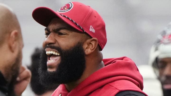 Arizona Cardinals defensive line coach Winston DeLattiboudere III yells out to his players during the team's practice at State Farm Stadium on July 29, 2025.