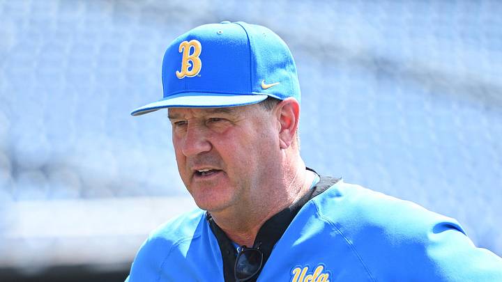 Jun 14, 2025; Omaha, Neb, USA;  UCLA Bruins head coach John Savage on the field before the game against the Murray State Races at Charles Schwab Field. Mandatory Credit: Steven Branscombe-Imagn Images