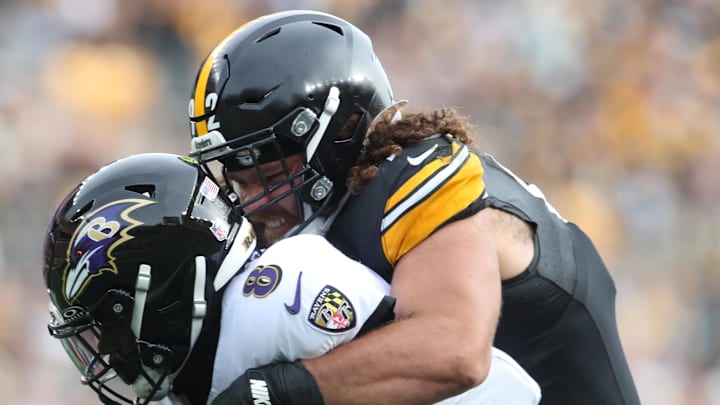 Pittsburgh Steelers defensive tackle Isaiahh Loudermilk (92) raps up Baltimore Ravens quarterback Lamar Jackson (8) 