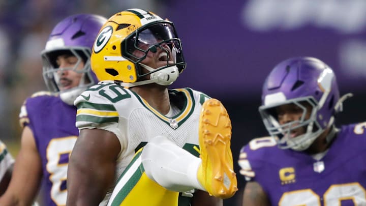 Green Bay Packers defensive end Barryn Sorrell (99) celebrates after tackliing Minnesota Vikings running back Ty Chandler.