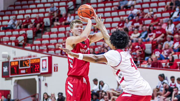 Indiana forward Trent Sisley shoots over forward Sam Alexis during the Cream and Crimson scrimmage Friday at Assembly Hall.