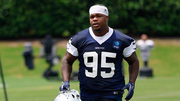 Dallas Cowboys DT Tommy Dunn jogs off the field after practice at the Ford Center at the Star Training Facility.