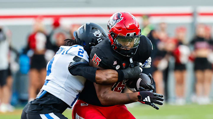Nov 9, 2024; Raleigh, North Carolina, USA; North Carolina State Wolfpack tight end Justin Joly (15) runs with the ball while Duke Blue Devils safety Jaylen Stinson (2) tackles him during the first half of the game at Carter-Finley Stadium. Mandatory Credit: Jaylynn Nash-Imagn Images Nov 9, 2024; Raleigh, North Carolina, USA; North Carolina State Wolfpack tight end Justin Joly (15) runs with the ball while Duke Blue Devils safety Jaylen Stinson (2) tackles him during the first half of the game at Carter-Finley Stadium. Mandatory Credit: Jaylynn Nash-Imagn Images