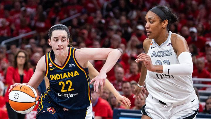 Indiana Fever guard Caitlin Clark (22) dribbles the ball while Las Vegas Aces center A'ja Wilson (22). Indiana Fever guard Caitlin Clark (22) dribbles the ball while Las Vegas Aces center A'ja Wilson (22).
