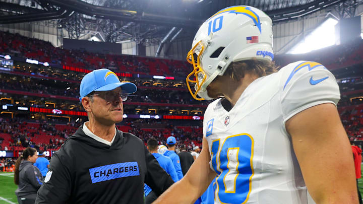 Dec 1, 2024; Atlanta, Georgia, USA; Los Angeles Chargers head coach Jim Harbaugh talks to quarterback Justin Herbert (10) after a victory over the Atlanta Falcons at Mercedes-Benz Stadium. Mandatory Credit: Brett Davis-Imagn Images