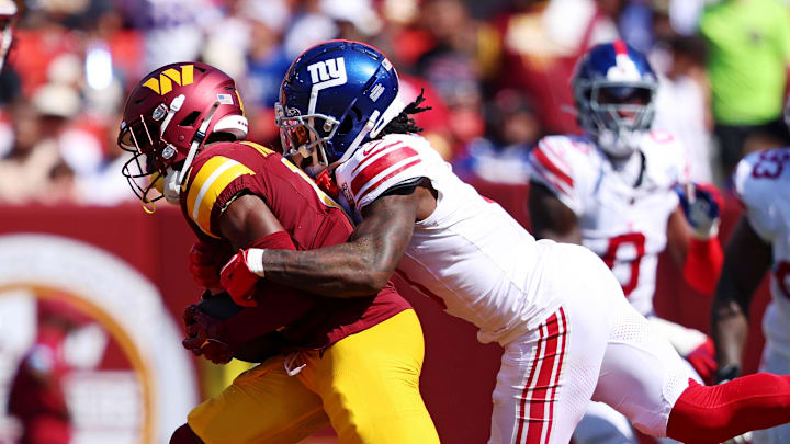 Sep 15, 2024; Landover, Maryland, USA; Washington Commanders wide receiver Terry McLaurin (17) catches the ball against New York Giants cornerback Deonte Banks (3) during the third quarter at Commanders Field. Mandatory Credit: Peter Casey-Imagn Images
