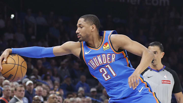 Feb 22, 2026; Oklahoma City, Oklahoma, USA; Oklahoma City Thunder guard Aaron Wiggins (21) reaches to save the ball from going out of bounds during a play against the Cleveland Cavaliers during the first half at Paycom Center. Mandatory Credit: Alonzo Adams-Imagn Images