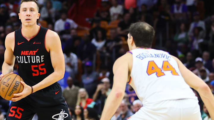 Apr 2, 2024; Miami, Florida, USA; Miami Heat forward Duncan Robinson (55) controls the basketball as New York Knicks forward Bojan Bogdanovic (44) defends during the fourth quarter at Kaseya Center. Mandatory Credit: Sam Navarro-USA TODAY Sports