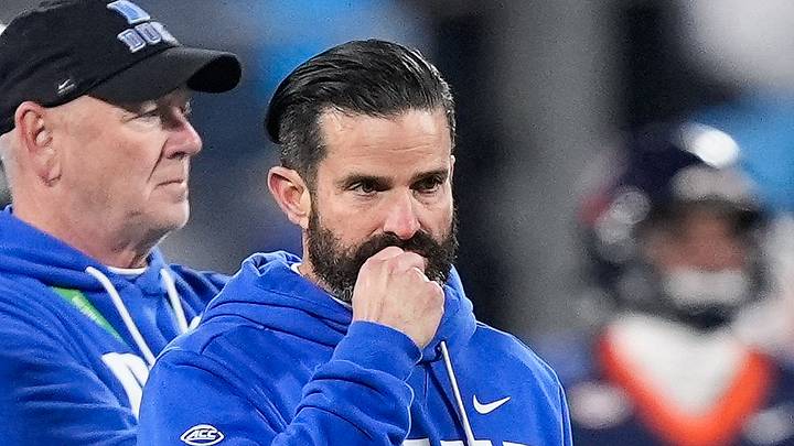Dec 6, 2025; Charlotte, NC, USA; Duke Blue Devils head coach Manny Diaz looks on during warm ups prior to the the 2025 ACC Championship game against the Virginia Cavaliers at Bank of America Stadium. Mandatory Credit: Jim Dedmon-Imagn Images Dec 6, 2025; Charlotte, NC, USA; Duke Blue Devils head coach Manny Diaz looks on during warm ups prior to the the 2025 ACC Championship game against the Virginia Cavaliers at Bank of America Stadium. Mandatory Credit: Jim Dedmon-Imagn Images
