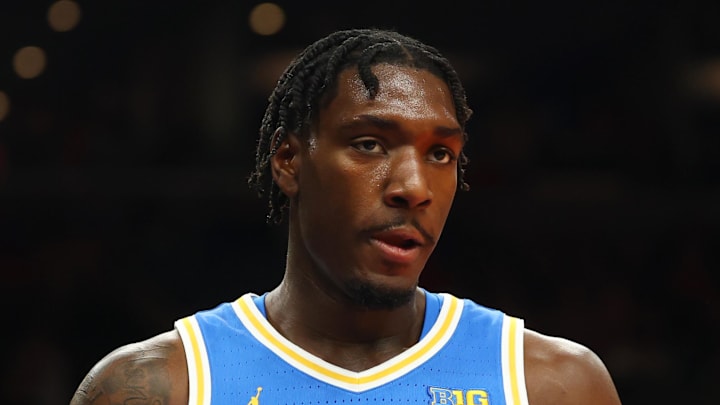 Dec 14, 2024; Phoenix, Arizona, USA; UCLA Bruins guard Eric Dailey Jr. (3) against the Arizona Wildcats at Footprint Center. Mandatory Credit: Mark J. Rebilas-Imagn Images
