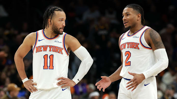 New York Knicks guard Jalen Brunson (11) with guard Miles McBride (2) against the Phoenix Suns at Mortgage Matchup Center. Mandatory Credit: Mark J. Rebilas-Imagn Images