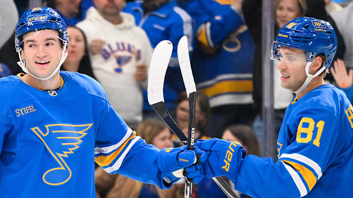 Mar 28, 2026; St. Louis, Missouri, USA; St. Louis Blues right wing Jimmy Snuggerud (21) is congratulated by left wing Dylan Holloway (81) after scoring against the Toronto Maple Leafs during the second period at Enterprise Center. Mandatory Credit: Jeff Curry-Imagn Images