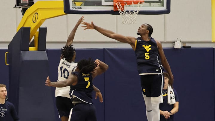 West Virginia University forward Toby Okani