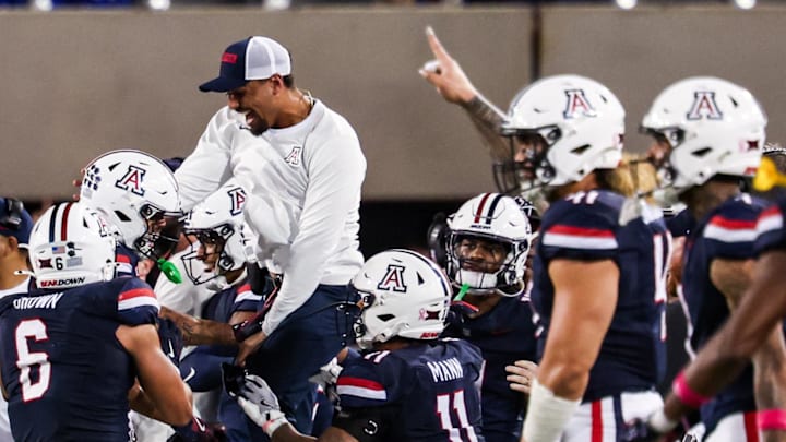 Oct 11, 2025; Tucson, Arizona, USA; Arizona Wildcats defensive back Dalton Johnson (43) celebrates an interception he caught from the Brigham Young Cougars with his team during the third quarter of the game at Arizona Stadium. Mandatory Credit: Aryanna Frank-Imagn Images