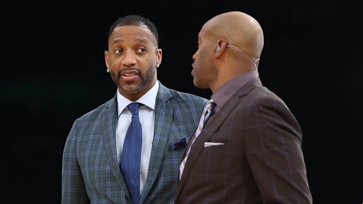 Mar 1, 2026; Boston, Massachusetts, USA; Former NBA players Tracy McGrady and Vince Carter react before a game between the Boston Celtics and the Philadelphia 76ers at TD Garden. Mandatory Credit: Paul Rutherford-Imagn Images