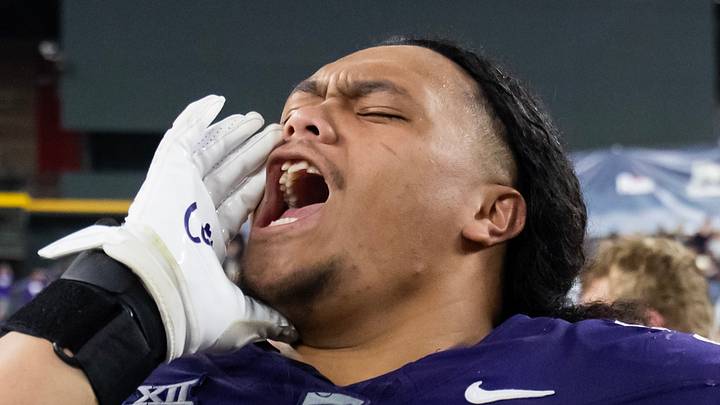 Kansas State Wildcats defensive tackle Uso Seumalo celebrates
