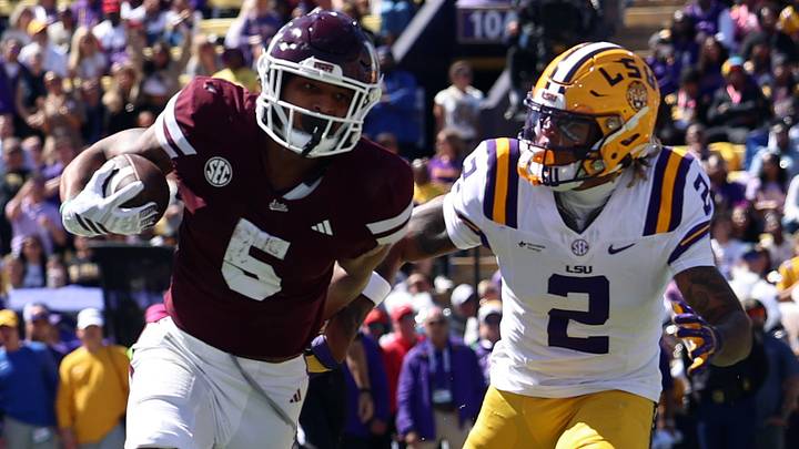Oct 17, 2026; Baton Rouge, Louisiana, USA; Mississippi State Bulldogs running back Xavier Gayten (5) runs past Louisiana State Tigers safety Ty Benefield (2) during the first half against at Tiger Stadium. Mandatory Credit: Stephen Lew-Imagn Images Oct 17, 2026; Baton Rouge, Louisiana, USA; Mississippi State Bulldogs running back Xavier Gayten (5) runs past Louisiana State Tigers safety Ty Benefield (2) during the first half against at Tiger Stadium. Mandatory Credit: Stephen Lew-Imagn Images