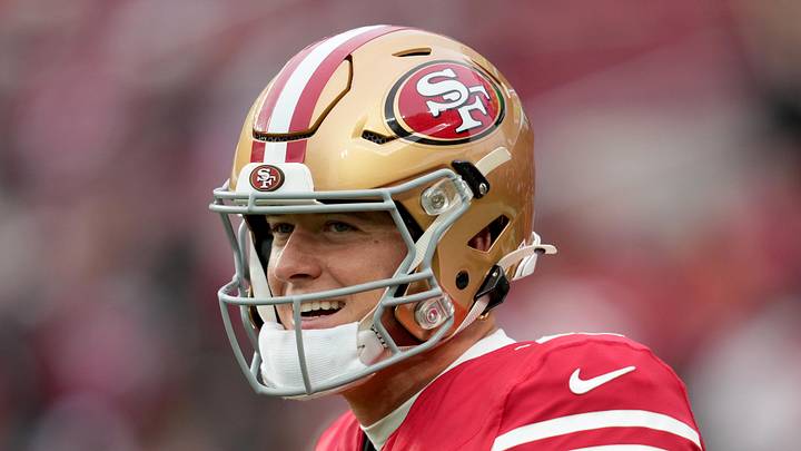 San Francisco 49ers quarterback Mac Jones warms up
