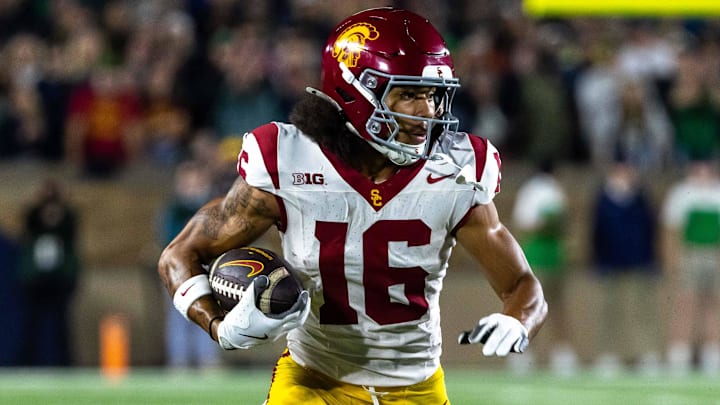 Oct 18, 2025; South Bend, Indiana, USA;  Southern California Trojans wide receiver Tanook Hines (16) runs the ball against the Notre Dame Fighting Irish during the first half  at Notre Dame Stadium. Mandatory Credit: Michael Caterina-Imagn Images
