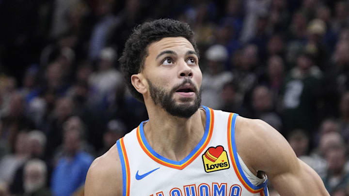 Jan 21, 2026; Milwaukee, Wisconsin, USA; Oklahoma City Thunder guard Ajay Mitchell (25) goest up for shot after stealing the ball from he Milwaukee Bucks at Fiserv Forum. Mandatory Credit: Michael McLoone-Imagn Images